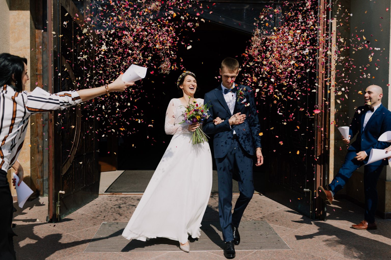 Dominika and Marcin leaving their wedding ceremony